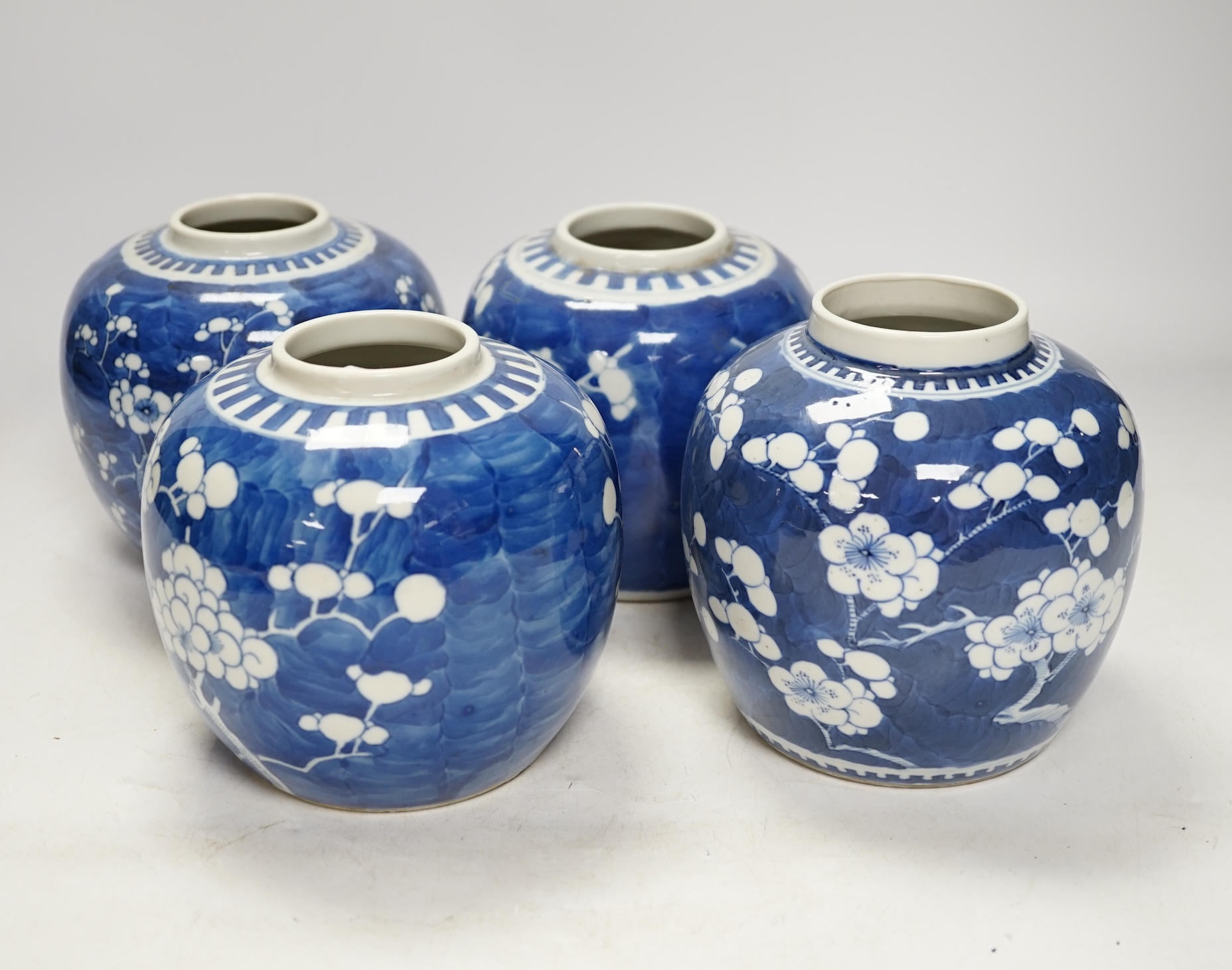 Four Chinese blue and white prunus jars (without covers), tallest 13.5cm. Condition - good